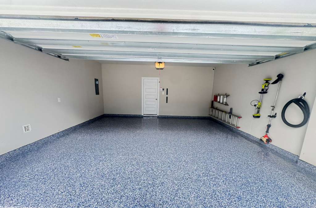 Garage floor after epoxy — blue grey flake finish